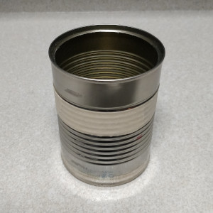 Wrapping tape around the can